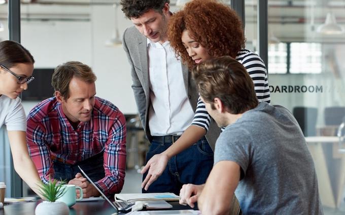 A group of people working together on a computer